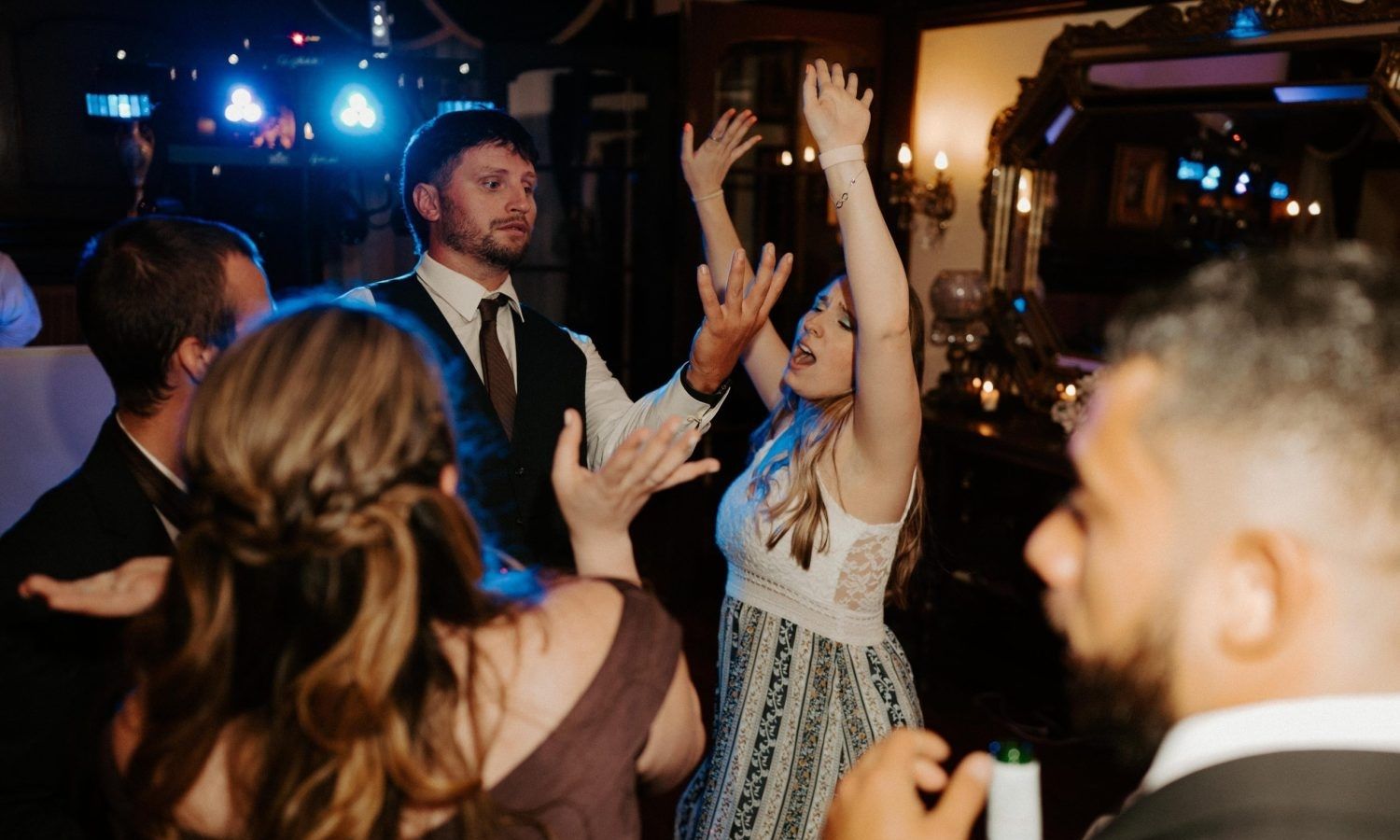 Wedding couple and guests celebrating on the dance floor with Electrolinear Entertainment